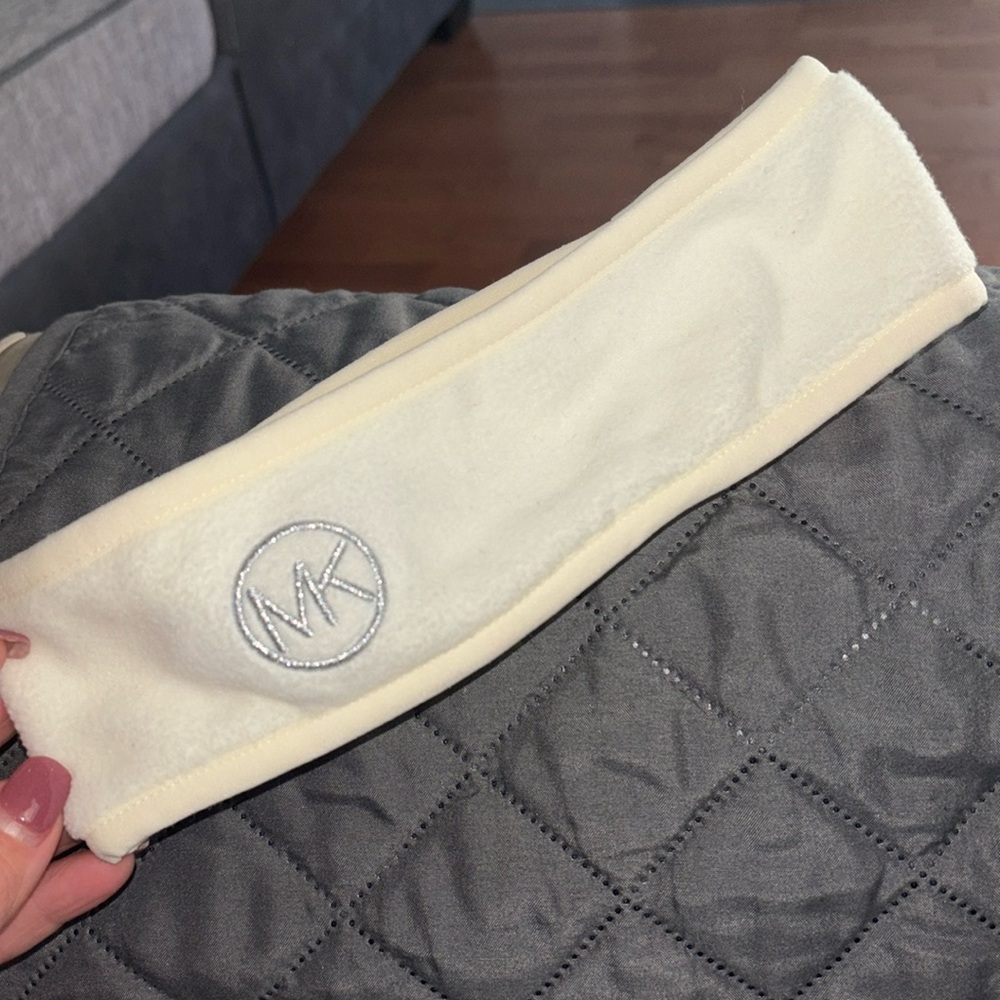 Cream fleece Michael Kors head/ear cover with silver thread emblem